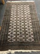 A Lahore Bokhara rug, Pakistan, on mauve ground,