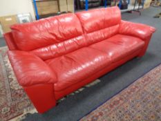 A contemporary red leather settee
