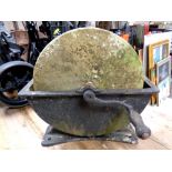 An antique grinding wheel
