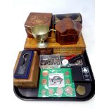 A tray of wooden trinket boxes, coins, watches, plated trophy, key ring,