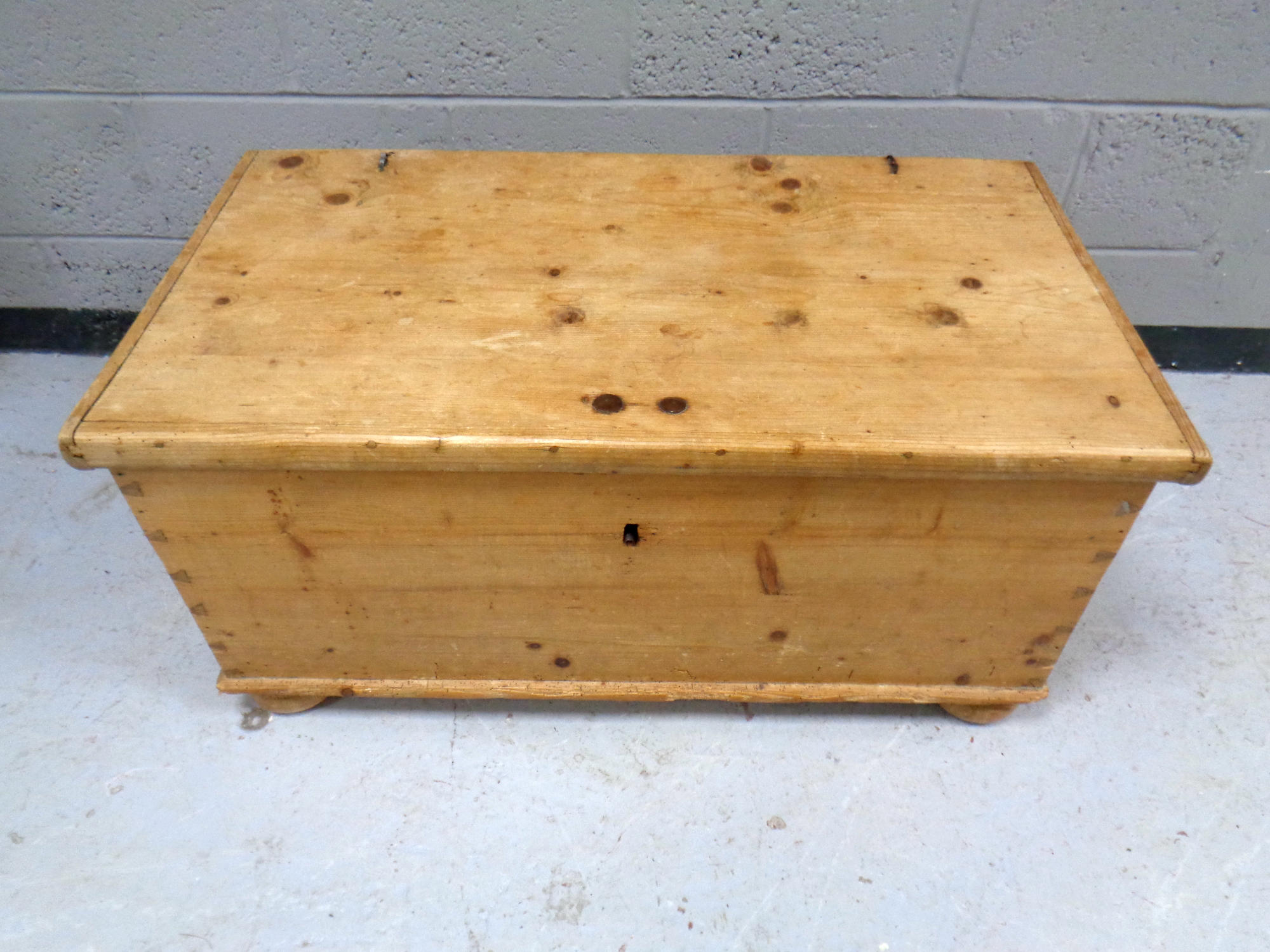 An antique pine blanket box