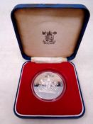 A 2014 silver £5 coin in case