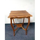 A shaped Edwardian occasional table