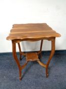 A shaped Edwardian occasional table