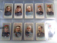 An album of wills and players cigarette cards including Products of the world, cap badges,