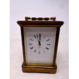 A brass cased eleven jewel carriage clock by Matthew Norman of London
