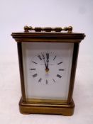 A brass cased eleven jewel carriage clock by Matthew Norman of London