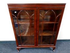 A mahogany double door bookcase