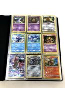 A folder of Pokemon cards, as illustrated.