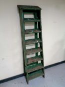 A set of vintage wooden step ladders