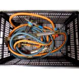 A crate of welding torches and hoses