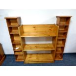 A set of pine open shelves together with two media stands