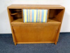 A 20th century sliding door bookcase