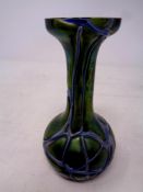An Art Nouveau green glass vase with silvered overlay, height 15.