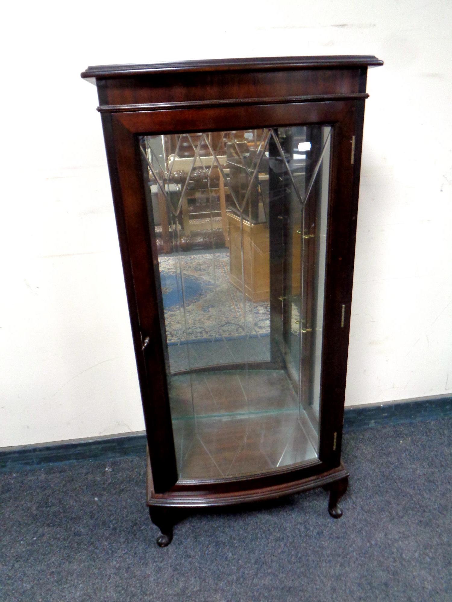 A mahogany bow fronted display cabinet on Queen Anne style legs CONDITION REPORT: