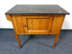 An Edwardian oak marble topped washstand