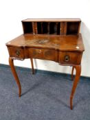 A Victorian lady's writing desk on cabriole legs, width 69 cm.