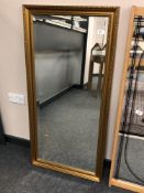 A contemporary gilt framed mirror 59 cm x 117 cm