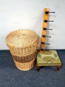 A wicker laundry basket with lid together with a six hook coat rack,