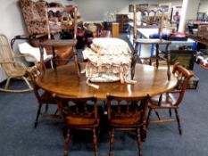 A good quality Titchmarsh and Goodwin oak oval dining table together with a set of eight dining