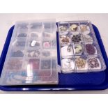 Two plastic storage boxes of costume necklaces and brooches,