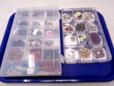 Two plastic storage boxes of costume necklaces and brooches,