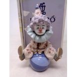 A Lladro figure Having a Ball,