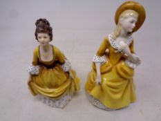 Two Royal Doulton figures;