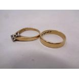 A 9ct gold lady's dress ring together with a 9ct gold wedding band