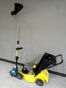 A Challenge petrol lawn mower together with a petrol strimmer