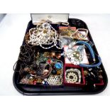 A tray of a large quantity of costume jewellery to include necklaces, brooches,