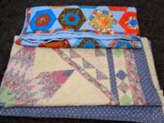 Two patchwork quilts