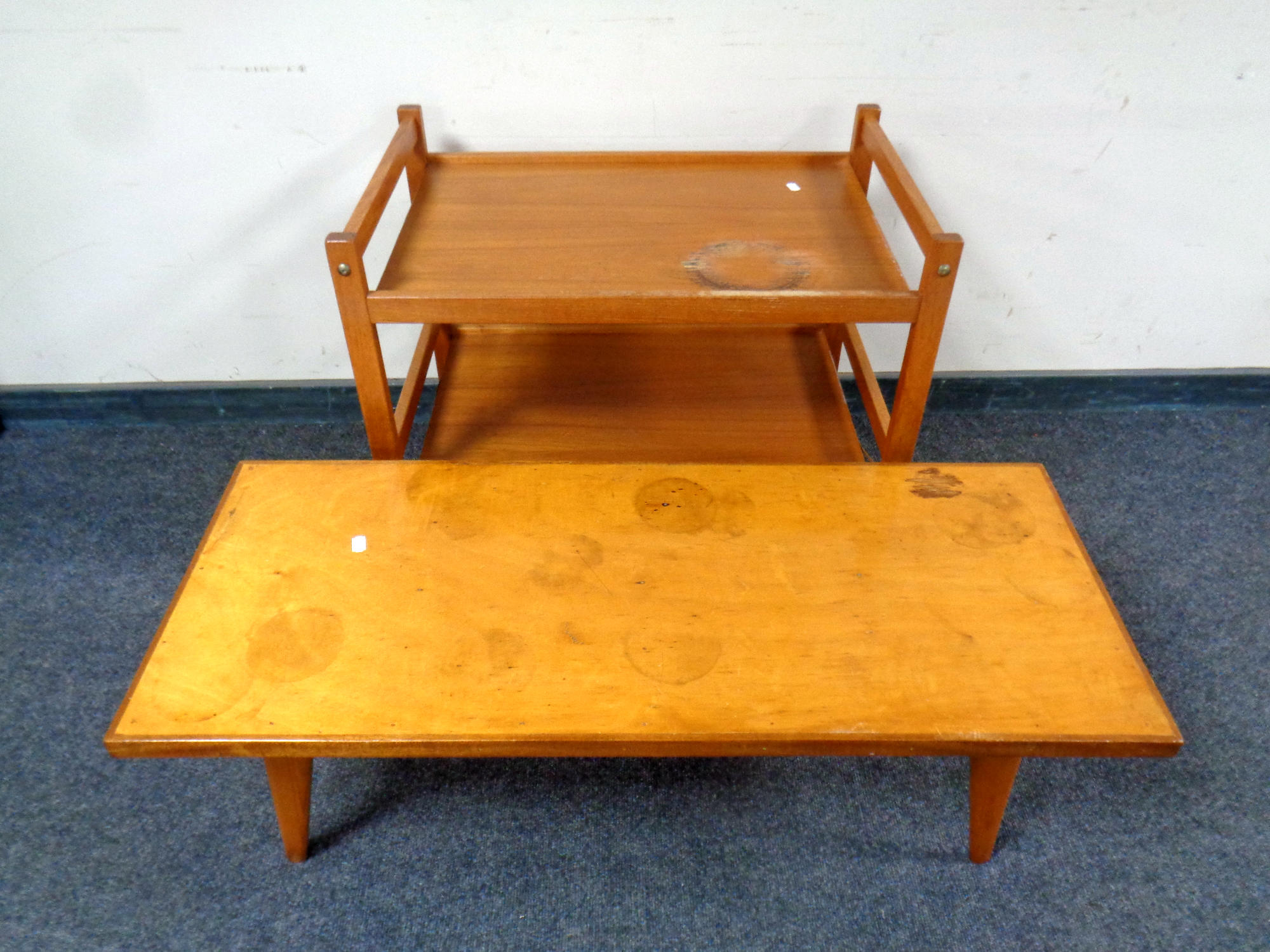 A mid century BTDR Furco teak two tier trolley together with plywood coffee table
