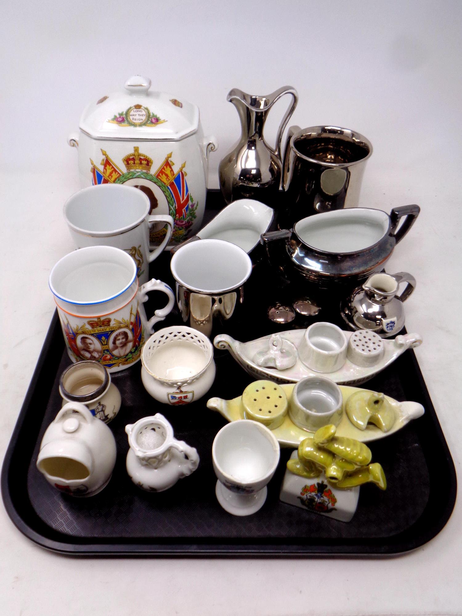 A tray of assorted ceramics, commemorative mugs, Ringtons caddy,