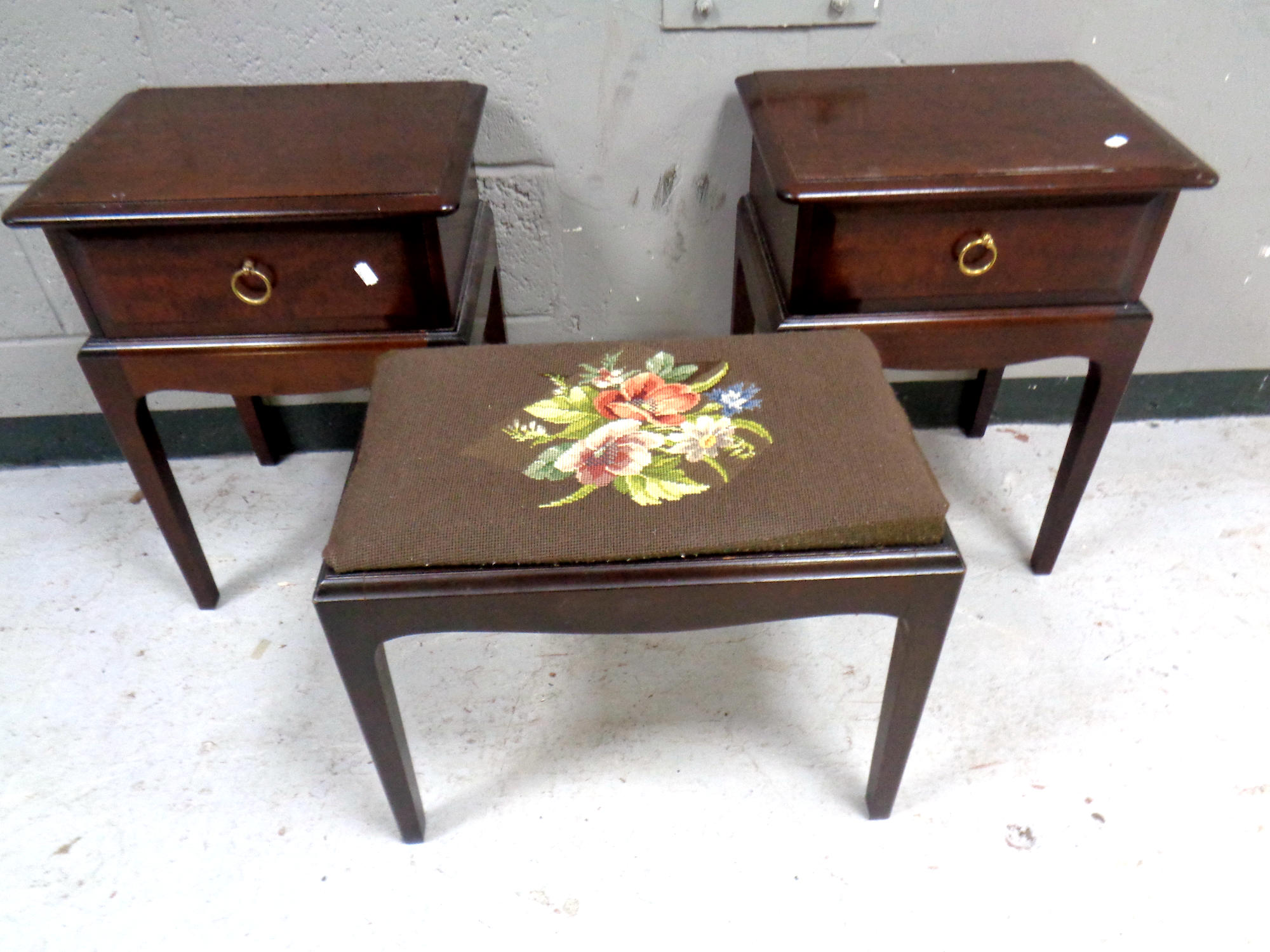 A pair of Stag Minstrel single drawer bedside stands on raised legs, width 44 cm,