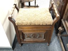 An Edwardian storage piano stool