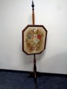 A Victorian mahogany pole screen
