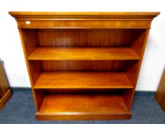 A set of Bradley yew wood open shelves, width 97 cm.