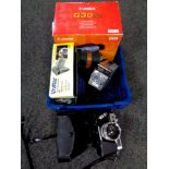 A basket of Canon and Vivitar digital video cameras, Halina super 8 camera,
