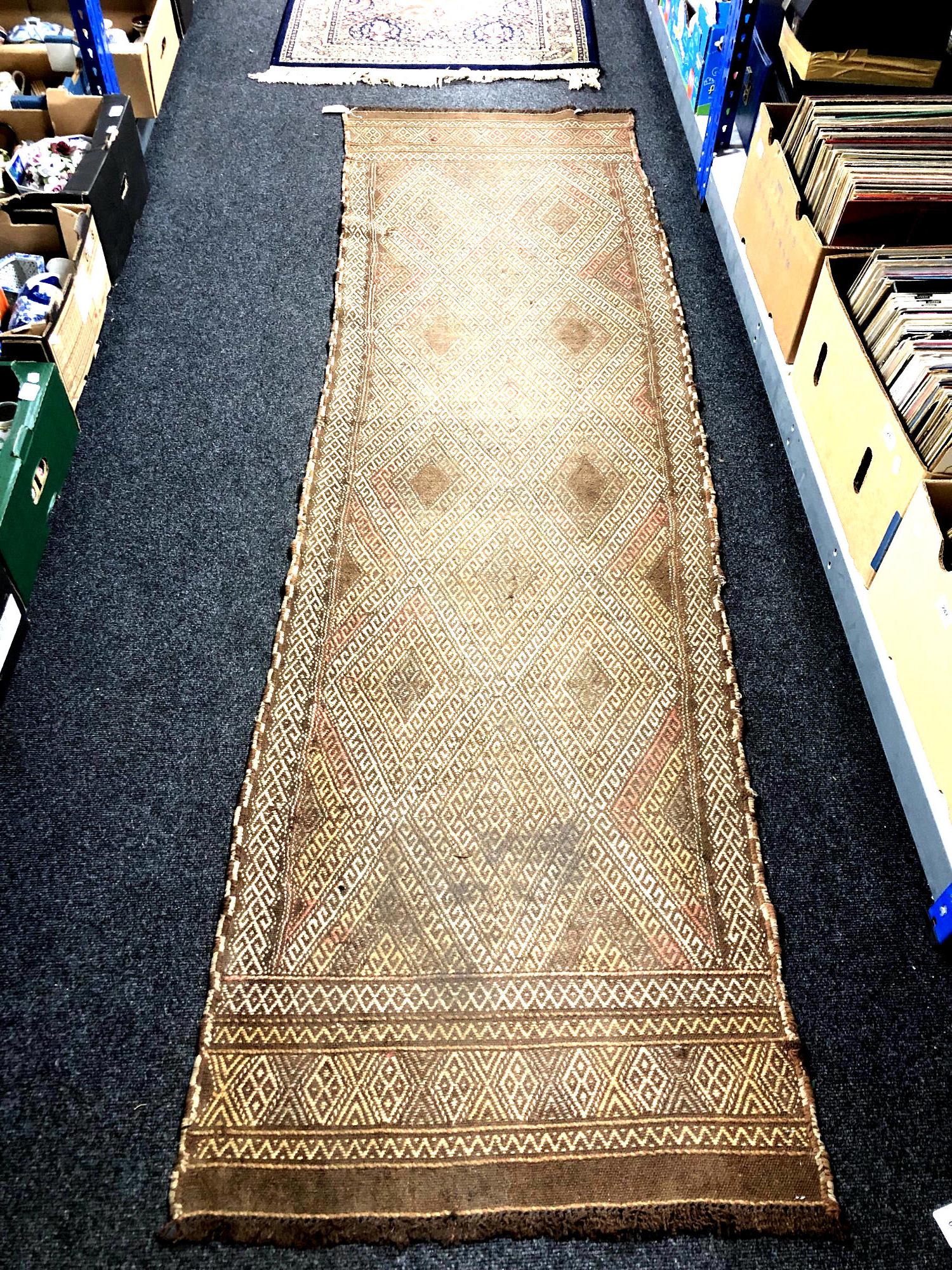 A Suzni kilim runner 257cm by 71cm