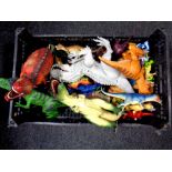 A crate of plastic dinosaurs