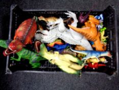 A crate of plastic dinosaurs