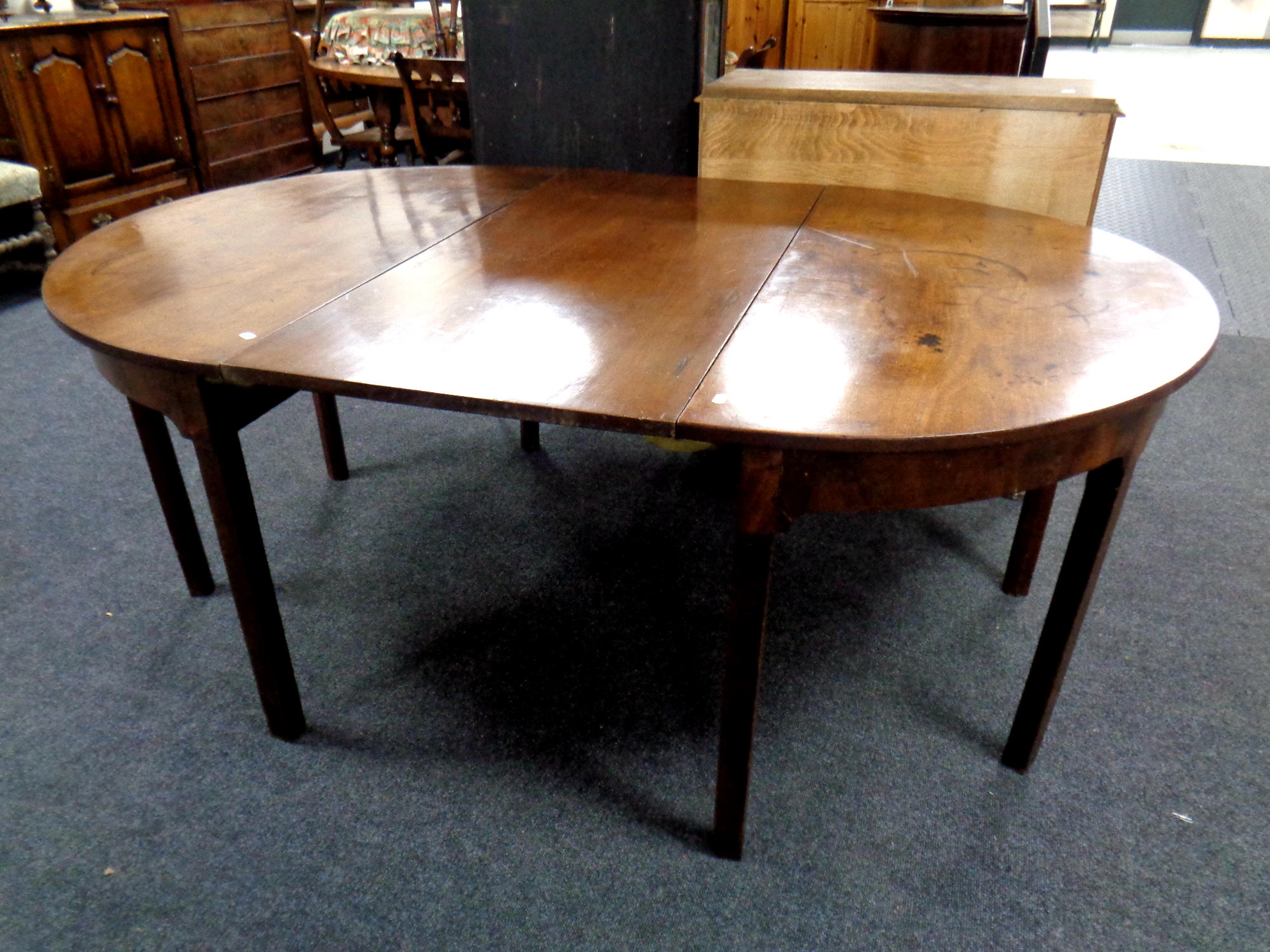 A 19th century mahogany D-end dining table with leaf