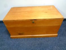 An antique pine blanket box