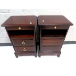 A pair of Stag Minstrel two drawer bedside chests with slide (af), width 40 cm.