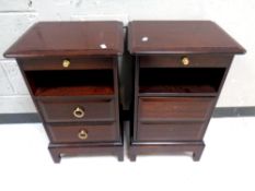 A pair of Stag Minstrel two drawer bedside chests with slide (af), width 40 cm.