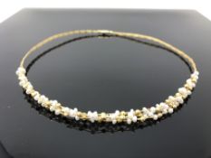 A 9ct gold and cultured pearl necklace, 10.8 g gross.