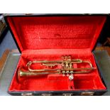 A Corton brass trumpet in fitted case