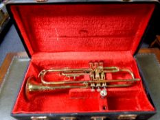 A Corton brass trumpet in fitted case