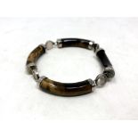 A Chinese white metal and polished stone bracelet
